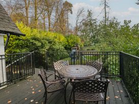 An outdoor space with a table and chairs at North Cottage Bowness-On-Windermere