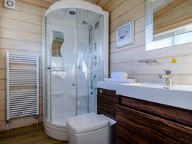 A bathroom with shower, toilet, and sink at Chestnut Spa in Carlton Miniott near Thirsk