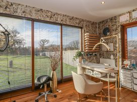 An office with a desk and chair at Garden Lodge 7, Swansea