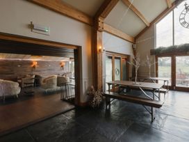 A dining room with a table and chairs at Rose Apartment Oldwalls near Reynoldston