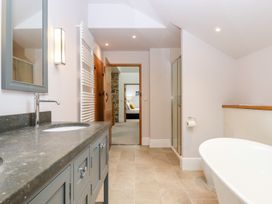 A bathroom with a sink and bath tub at Knowle House Okehampton