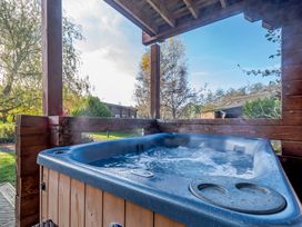 A hot tub in an outdoor area at Birch Waterside Spa Carlton Miniott near Thirsk