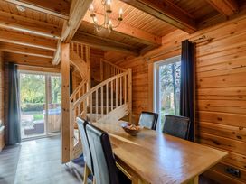 A dining room with a table and chairs at Birch Spa Carlton Miniott near Thirsk