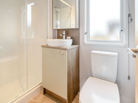 A bathroom with a sink and toilet at Cedar Spa Carlton Miniott near Thirsk