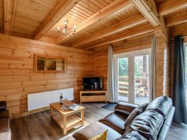 A living room with a sofa and coffee table at Birch Waterside Spa (Pet) Carlton Miniott near Thirsk