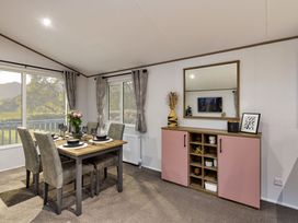 A dining room with a table and chairs at Laurel Spa Carlton Miniott near Thirsk