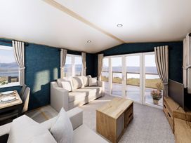 A living room with a sofa and coffee table at Willow Spa (Pet) Carlton Miniott near Thirsk