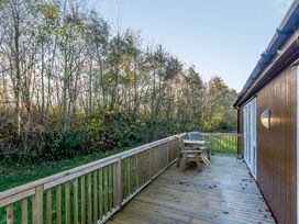An outdoor area with decking and furniture at Cherry Tree in Carlton Miniott near Thirsk