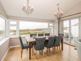 A dining room with a table and chairs at Dunholme