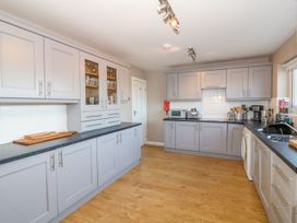 A kitchen with cabinets and appliances at Dunholme
