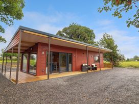 A cottage with a deck and outdoor furniture at Killinure Cottage, Glasson, County Westmeath
