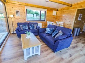 A living room with sofas and a coffee table at Killinure Cottage in Glasson, County Westmeath