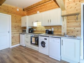 A kitchen with appliances including an oven and washing machine at Killinure Cottage Glasson, County Westmeath