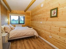A bedroom with bed and window at Killinure Cottage in Glasson, County Westmeath
