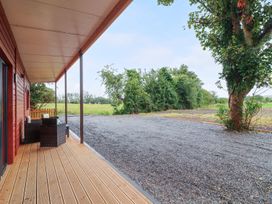 A porch with seating and gravel area at Killinure Cottage in Glasson, County Westmeath