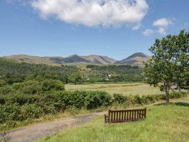 A view of mountains and a bench at Cragg Cottage in Coniston