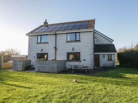 A house with solar panels and garden at Low Greenlands House Tewitfield