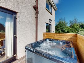 An outdoor area with a hot tub at Low Greenlands House Tewitfield