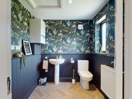 A bathroom with sink and toilet at Low Greenlands House in Tewitfield