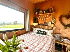 A bedroom with a bed and window at Harriet in Llangurig