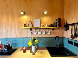 A kitchen with a sink and kettle at Harriet in Llangurig