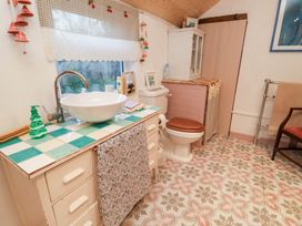A bathroom with a sink and toilet at The Hare & the Bumblebee Cottage