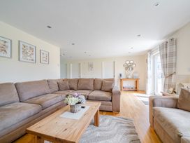 A living room with a sofa and coffee table at Aspen Lodge Near Brigg