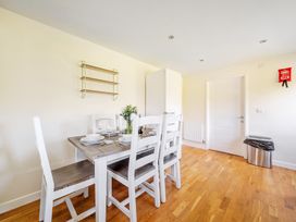 A dining room with a table and chairs at Sage Lodge near Brigg