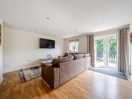 A living room with a sofa and television at Paddington Lodge near Brigg