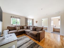A living room with a sofa and television at Paddington Lodge near Brigg