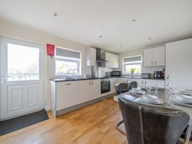 A kitchen with countertop and dining area at Paddington Lodge near Brigg