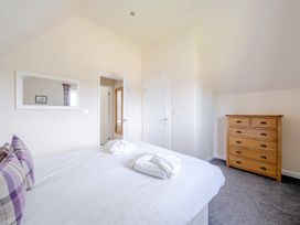 A bedroom with a bed and chest of drawers at Paddington Lodge near Brigg