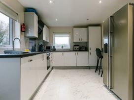 A kitchen with appliances and a countertop at Charcoal Lodge in Brigg
