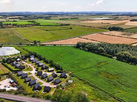 An aerial view of houses and fields at Charcoal Lodge in Brigg