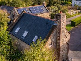 A roof with solar panels and a chimney in an outdoor area at The Old Boat House Lyme Regis