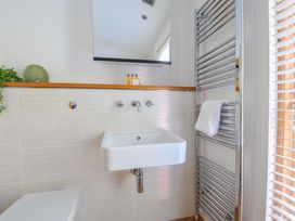 A bathroom with a washbasin and towel rack at 6 Stonerush Valley Looe