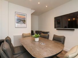 A dining room with a table and chairs at OG's House in Whitby
