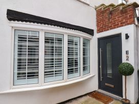 A home entrance with a front door and window at Og's House in Whitby