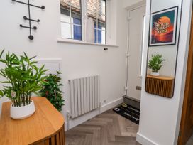 A hallway with plants and a mirror at Og's House in Whitby