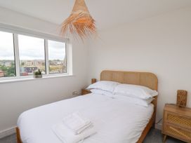 A bedroom with a bed and a window at Og's House in Whitby