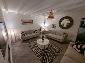 A living room with sofas and a coffee table at Og's House in Whitby