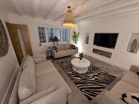 A living room with a sofa and armchair at Og's House in Whitby