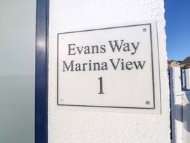 An address nameplate for Evans Way Marina View 1 in Pwllheli