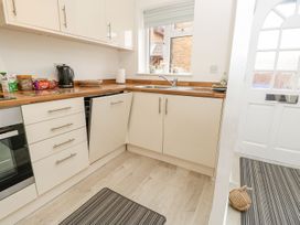 A kitchen with a sink and kettle at Harbour View Poole