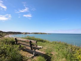 A bench overlooking the sea at Bodefi in Pwllheli