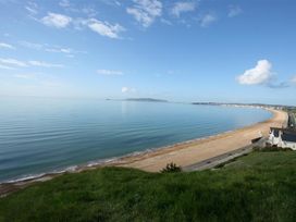 A beach view with sea and sand at Old Harbour View in Weymouth