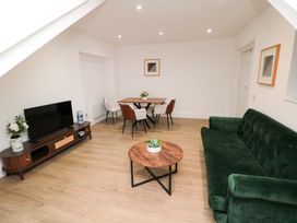 A living room with a sofa and coffee table at Beachwalk Villa 3 in Whitby