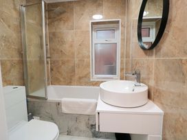 A bathroom with a sink and shower at Beachwalk Villa 3 in Whitby