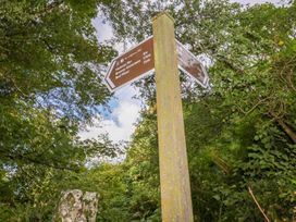 A signpost indicating directions to Helman Tor and Red Moor