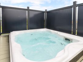 A hot tub in an outdoor area at Blencathra Family (Pet) in Penrith